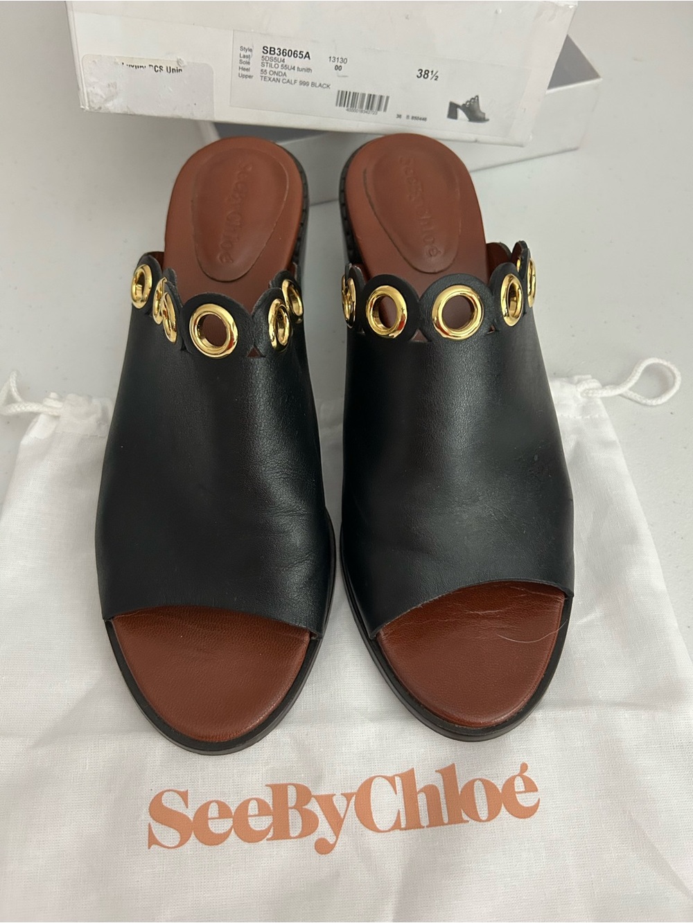 See By Chloé Black Leather Slide Sandals with Gold Eyelet Trim